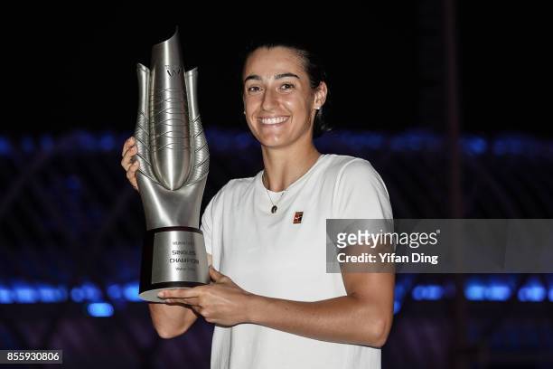 Caroline Garcia kisses the trophy for the champion portrait after winning the ladies singles final between Ashleigh Barty of Australia and Caroline...