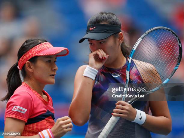 Shuko Aoyama of Japan and Zhaoxuan Yang of China in action in the Finals Double match between Yung-Jan Chan of Chinese Taipei and Martina Hingis of...