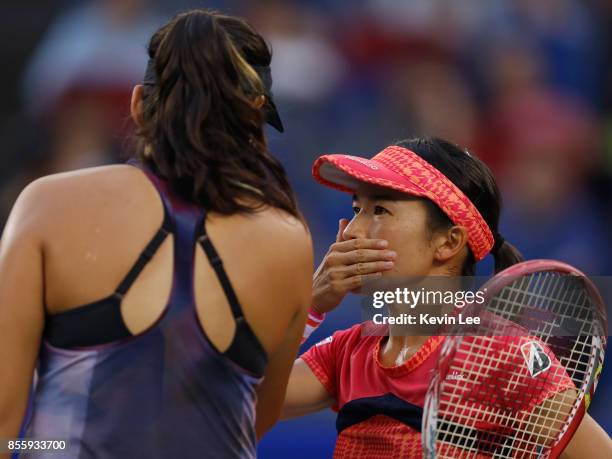 Shuko Aoyama of Japan and Zhaoxuan Yang of China in action in the Finals Double match between Yung-Jan Chan of Chinese Taipei and Martina Hingis of...