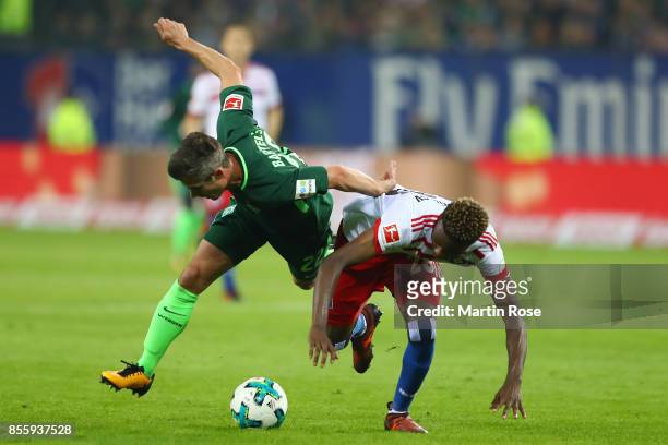 Fin Bartels of Bremen fights for the ball with Gideon Jung of Hamburg during the Bundesliga match between Hamburger SV and SV Werder Bremen at...