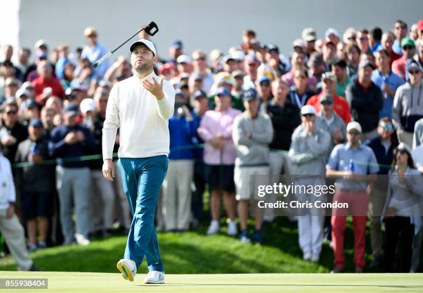 Branden Grace of South Africa and the International Team reacts to a missed putt for birdie on the 12th hole during the Saturday morning foursomes...