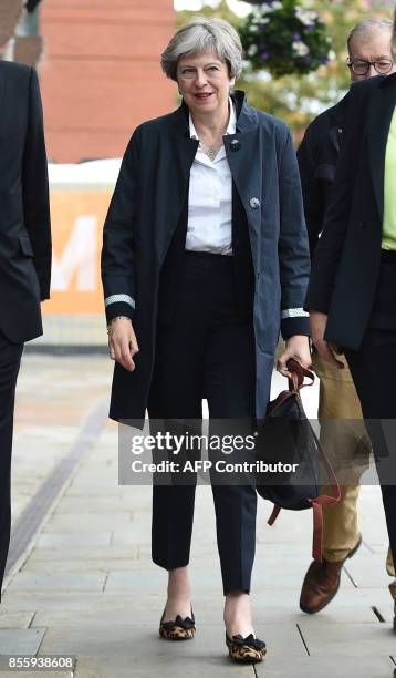 Britain's Prime Minister Theresa May arrives at the Midland Hotel in Manchester on September 30 ahead of the Conservative party annual conference....