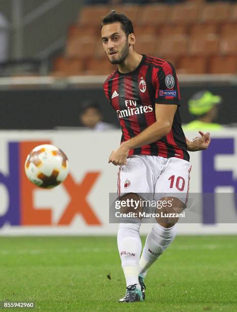 Hakan Calhanoglu of AC Milan gestures during the UEFA Europa League group D match between AC Milan and HNK Rijeka at Stadio Giuseppe Meazza on...