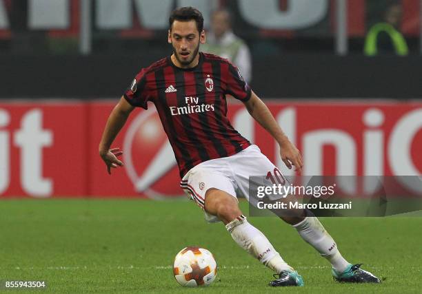 Hakan Calhanoglu of AC Milan gestures during the UEFA Europa League group D match between AC Milan and HNK Rijeka at Stadio Giuseppe Meazza on...