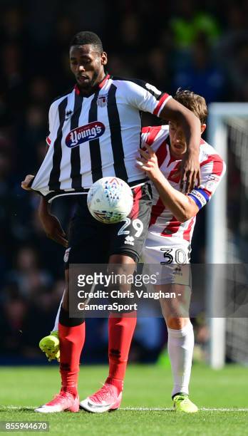 Grimsby Town's Jamille Matt shields the ball from Lincoln City's Alex Woodyard during the Sky Bet League Two match between Grimsby Town and Lincoln...