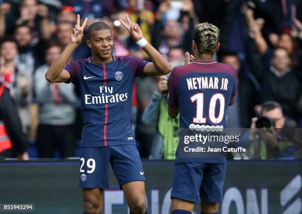 Kylian Mbappe of PSG celebrates his goal with Neymar Jr during the French Ligue 1 match between Paris Saint-Germain and FC Girondins de Bordeaux at...