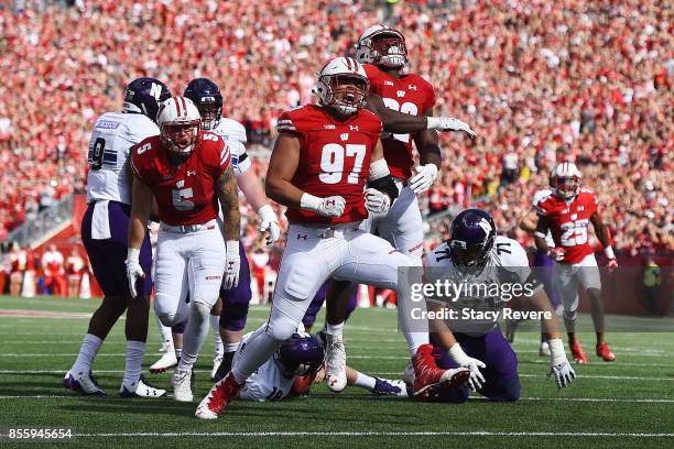Isaiahh Loudermilk of the Wisconsin Badgers reacts to a sack against the Northwestern Wildcats during the first quarter of a game at Camp Randall...