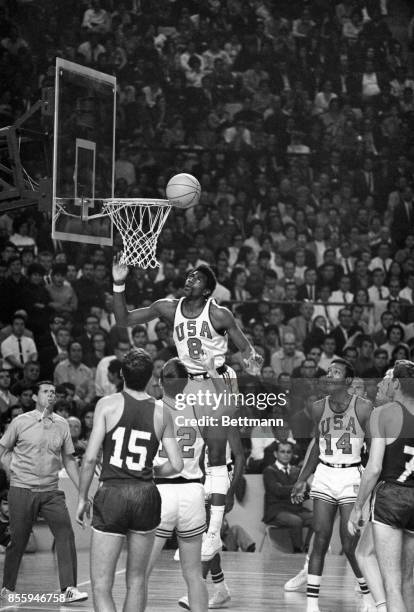 The USA’s Spencer Haywood lays one up against Yugoslavia in final game of the Olympic basketball competition 10/25. At left is Yugo’s Petar Skansi....