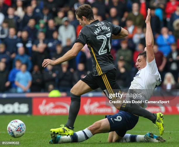 Preston North End's Jordan Hugill slides in on Sunderland's Adam Matthews during the Sky Bet Championship match between Preston North End and...