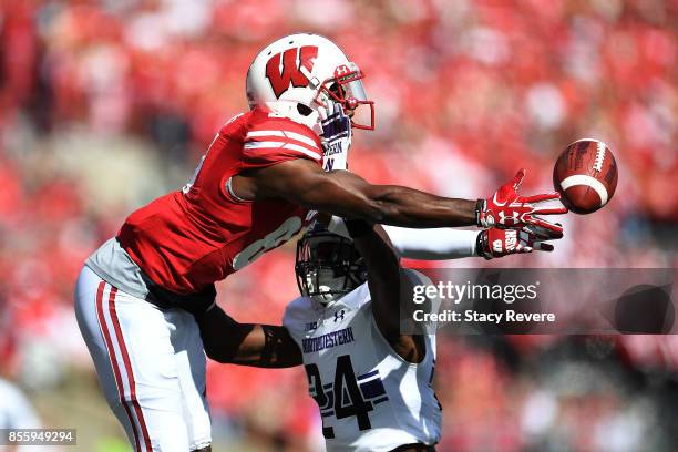 Montre Hartage of the Northwestern Wildcats defends a pass intended for Quintez Cephus of the Wisconsin Badgers during the first quarter of a game at...