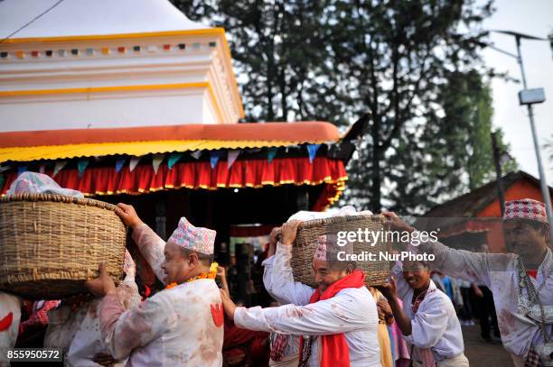 Nepali Hindu priests carrying basket during the tenth day of Dashain Durga Puja Festival in Bramayani Temple, Bhaktapur, Nepal on September 30, 2017....