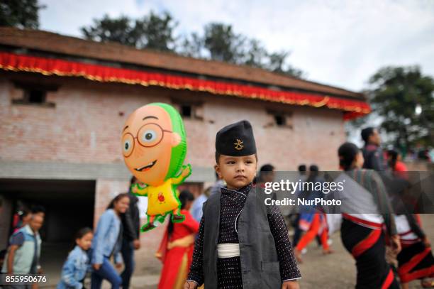 5yrs old, Bewan Manandhar in a traditional attire arrive to participate in the festival with his family members during the tenth day of Dashain Durga...