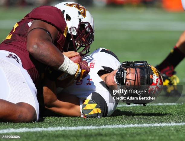 Thomas Barber of the Minnesota Golden Gophers stops Ryan Brand of the Maryland Terrapins on the one yard line in the first quarter at TCF Bank...