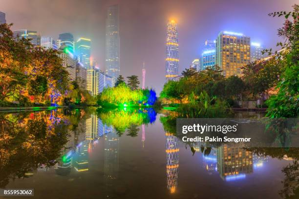 modern urban night view and waterfront buildings in the park at guangzhou, china - dongguan stock pictures, royalty-free photos & images