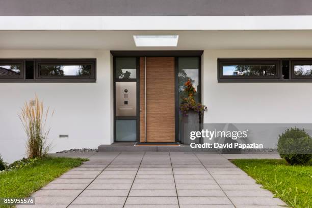 inviting brown front door - apartment front door stock pictures, royalty-free photos & images