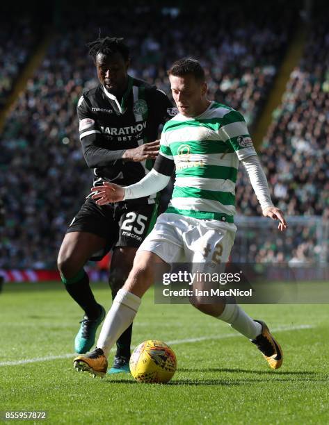 Callum McGregor of Celtic bids with Efe Ambrose of Hibernian during the Ladbrokes Scottish Premiership match between Celtic and Hibernian at Celtic...