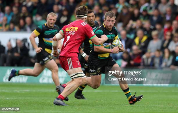 Alex Waller of Northampton moves past Jack Clifford during the Aviva Premiership match between Northampton Saints and Harlequins at Franklin's...