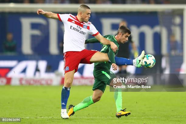 Kyriakos Papadopoulos of Hamburg fights for the ball with Fin Bartels of Bremen during the Bundesliga match between Hamburger SV and SV Werder Bremen...