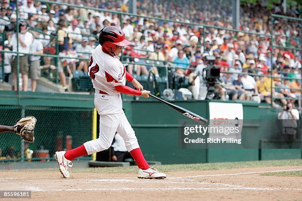 Ryo Kanekubo of Japan hits home run during the Little League World Series International Championship Game against the Caribbean team at Lamade...