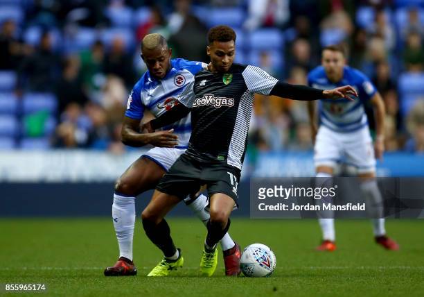 Josh Murphy of Norwich is tackled by Leandro Bacuna of Reading during the Sky Bet Championship match between Reading and Norwich City at Madejski...