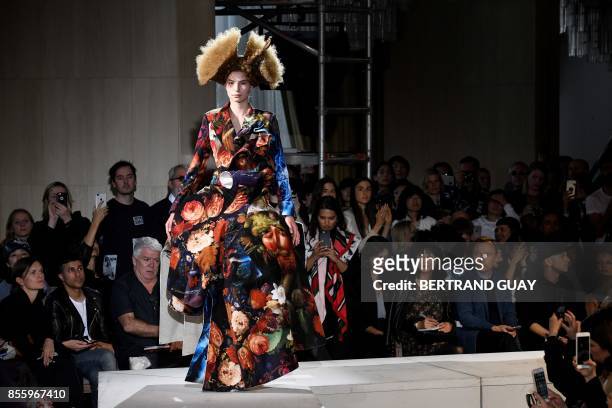 Model presents a creation by Comme des garcons, during the women's 2018 Spring/Summer ready-to-wear collection fashion show in Paris, on September...