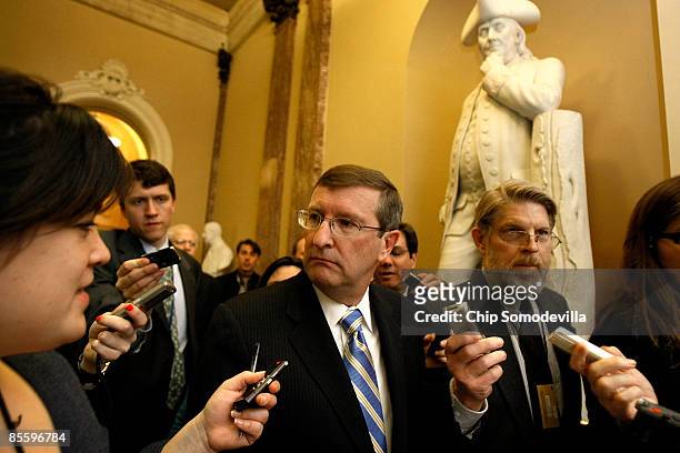 Senate Budget Committee Chairman Kent Conrad is surrounded by reporters after a closed-door meeting of the Senate Democratic caucus at the U.S....