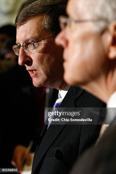 Senate Budget Committee Chairman Kent Conrad answers reporters' questions with Senate Majority Leader Harry Reid after a closed-door meeting of the...