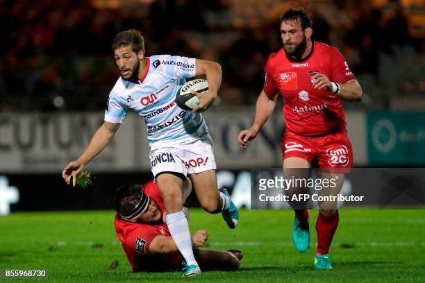 Racing-Metro's Teddy Iribaren runs with the ball during the French Top 14 rugby union match between Racing Metro 92 and Lyon Olympique Universitaire...