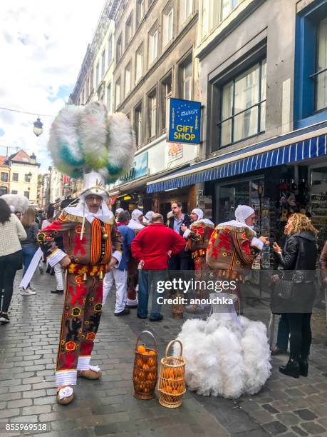 gilles of binche, clown-like personnages on brussels street, belgium - national day of belgium 2017 stock pictures, royalty-free photos & images