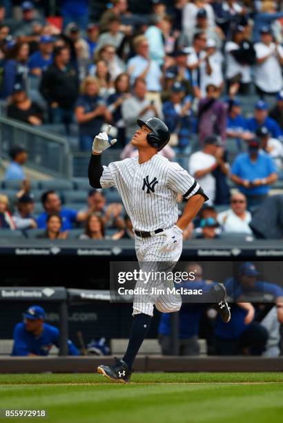 Aaron Judge of the New York Yankees reacts as he runs the bases after his fourth inning home run against the Toronto Blue Jays at Yankee Stadium on...