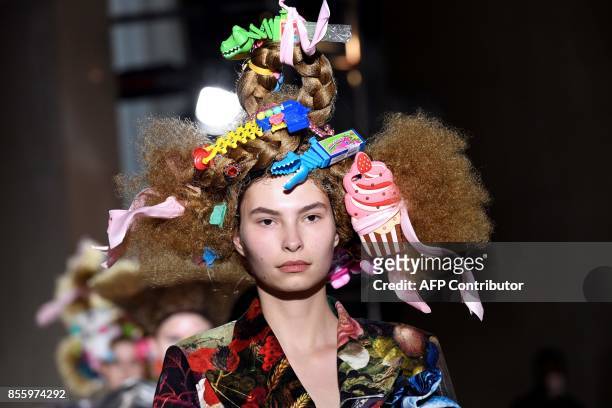 Model presents a creation by Comme des garcons, during the women's 2018 Spring/Summer ready-to-wear collection fashion show in Paris, on September...