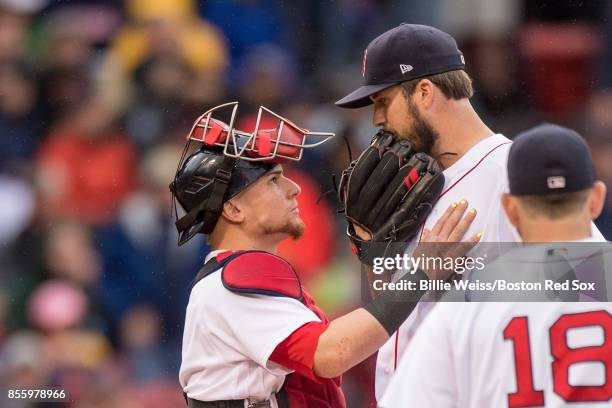 Drew Pomeranz of the Boston Red Sox reacts with Christian Vazquez as he exits the game during the seventh inning of a game against the Houston Astros...