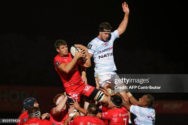 Lyon's French flanker Julien Puricelli jumps for the ball during the French Top 14 rugby union match between Racing Metro 92 and Lyon Olympique...