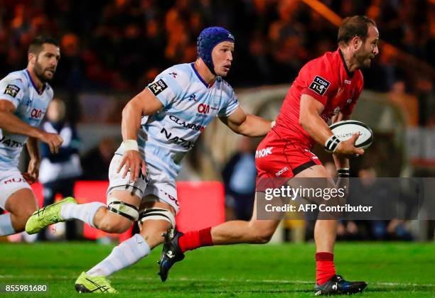 Lyon's French fly-half Frederic Michalak runs with the ball during the French Top 14 rugby union match between Racing Metro 92 and Lyon Olympique...