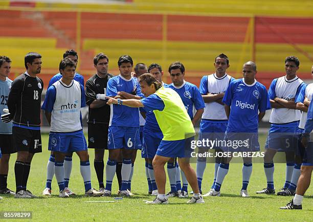 El Salvador national football team coach Carlos de Los Cobos gives instructions to his players during a training session at The Cuscatlan Stadium in...