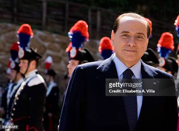 Italian Prime Minister Silvio Berlusconi poses for photographs ahead of a lunch at Villa Madama on March 25, 2009 in Rome, Italy. King Carl XVI...