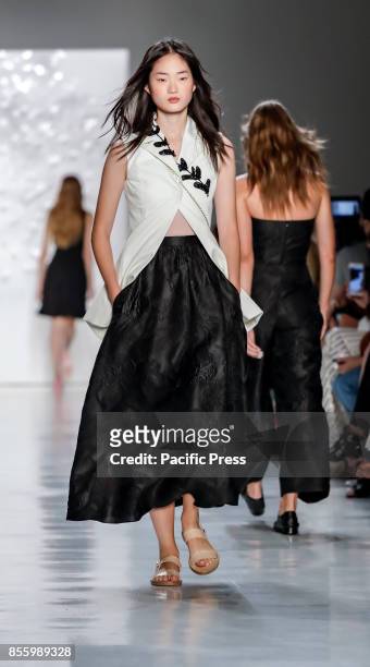 Model walks runway for the Noon by Noor Spring/Summer 2018 runway show during New York Fashion Week at Skylight Clarcson Sq., Manhattan.