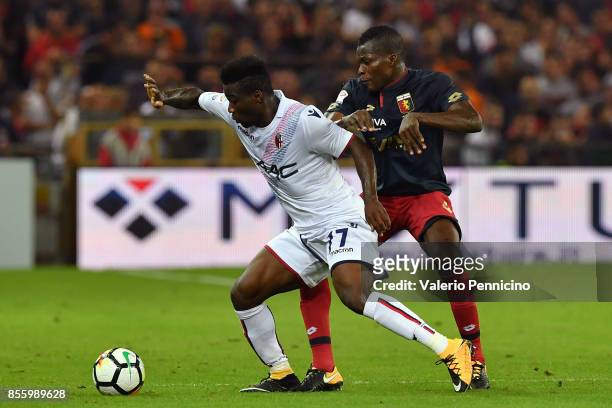 Isaac Cofie of Genoa CFC competes with Juan Valencia of Bologna FC during the Serie A match between Genoa CFC and Bologna FC at Stadio Luigi Ferraris...