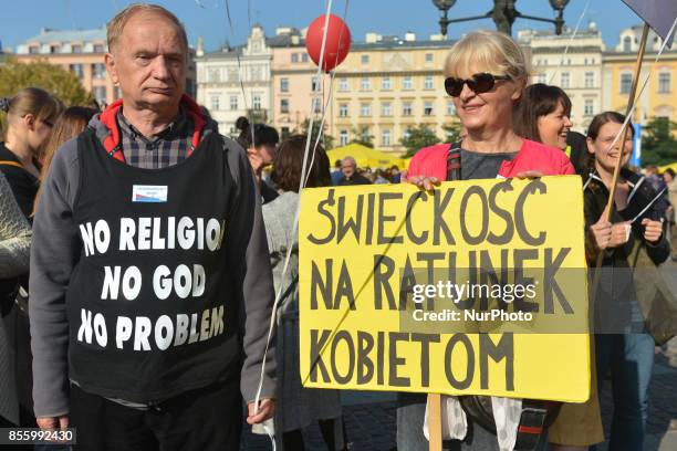 Activist holds a sign with a description 'Secularism to Rescue Women' and during 'The March of Secularity' protest to demand a secular education and...