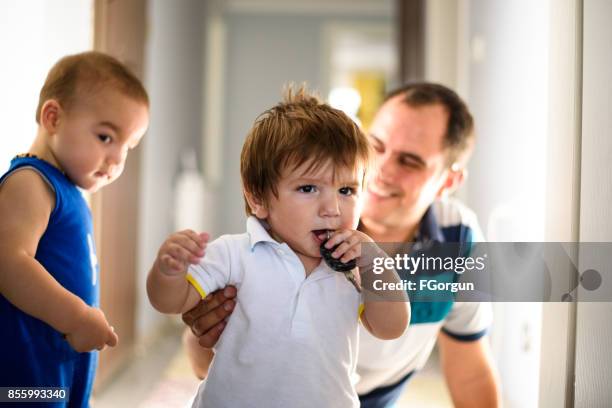 little boy jealous of his baby brother - brother jealous stock pictures, royalty-free photos & images