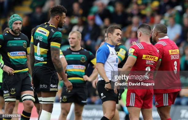 Luke Pearce, the referee talks to Harlequins captain Dave Ward as a penalty is awarded against Kyle Sinckler for an alleged eye guaging on...