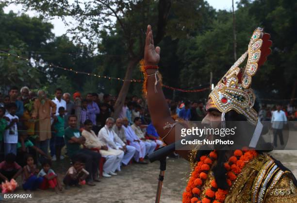 An indian artist,dressed as Demon character,performs during traditional Ramleela,a play narrating the life of Hindu God Ram,on ocassion of Dussehra...