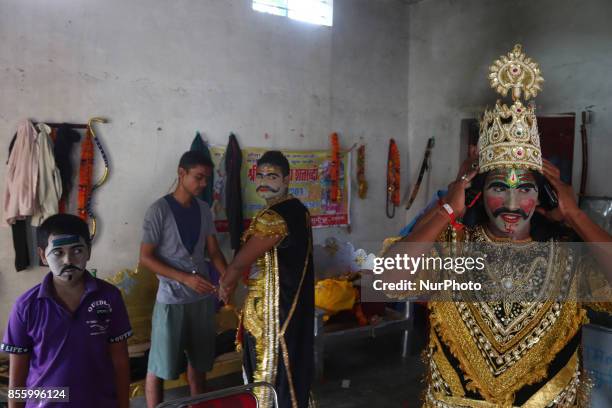 Indian artists dress up brfore traditional Ramleela,on ocassion of Dussehra festival,in Hanumanganj village,24 kms from Allahabad on September...