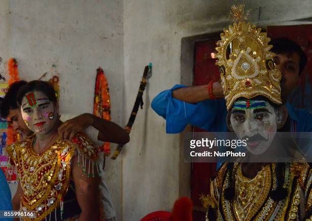 Indian artists dress up brfore traditional Ramleela,a play narrating the life of Hindu God Ram,on ocassion of Dussehra festival,in Hanumanganj...