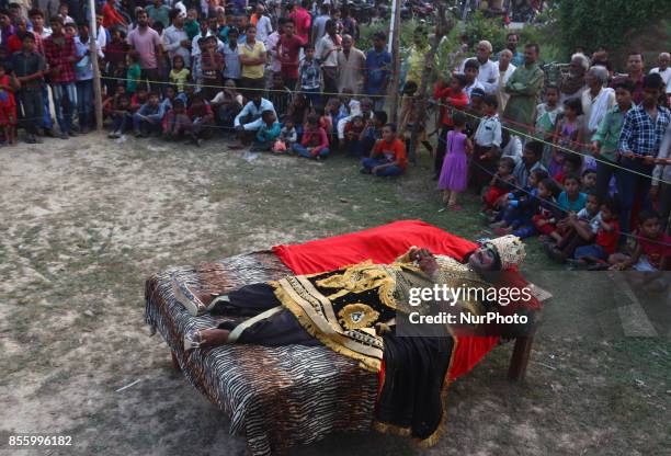 An indian artist,dressed as Demon character,performs during traditional Ramleela,a play narrating the life of Hindu God Ram,on ocassion of Dussehra...