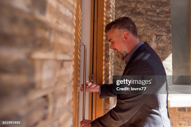 hello, i’m home! - unlocking stock pictures, royalty-free photos & images