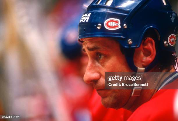 Bob Gainey of the Montreal Canadiens watches the action from the bench during an NHL game against the New Jersey Devils on October 16, 1987 at the...