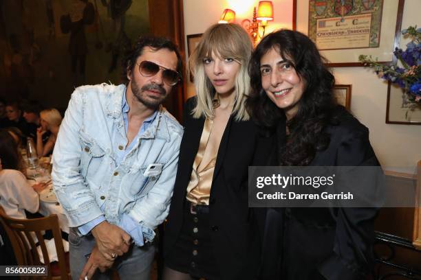 Olivier Zahm, Anja Rubik, and Yasmine Eslami attend a dinner in Paris to celebrate Another Magazine A/W17 hosted by Vivienne Westwood, Andreas...