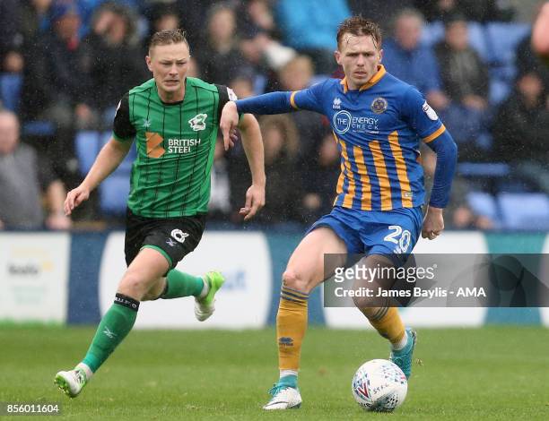 Sam Mantom of Scunthorpe United and Jon Nolan of Shrewsbury Town during the Sky Bet League One match between Shrewsbury Town and Scunthorpe United at...