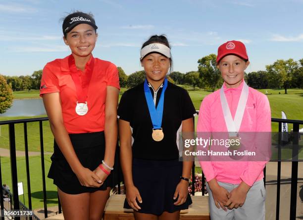 Second, first and third place overall for the girls 12-13 category Alexa Pano, Vunnisa Vu and Treva Dodd pose for a photo at the regional round of...